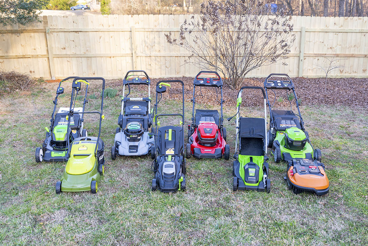A group of the best electric mowers together in a yard