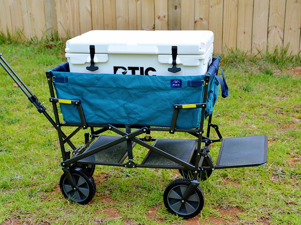 The best folding wagon option being used in yard to transport a cooler