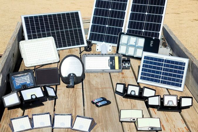 The 9 best solar floor light options together on a wooden table before testing.