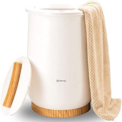 The Keenray Bucket Towel Warmer on a white background with a tan towel draped over its edge.