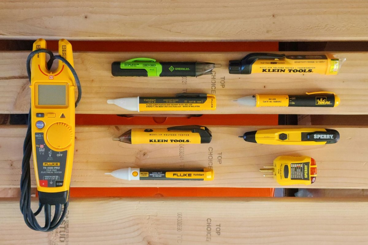 A group of the 8 best voltage testers together on a workbench before testing.