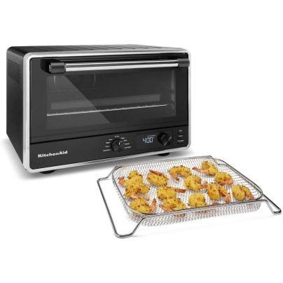 The KitchenAid Digital Countertop Oven With Air Fry with a tray of air-fried tempura shrimp on a white background.