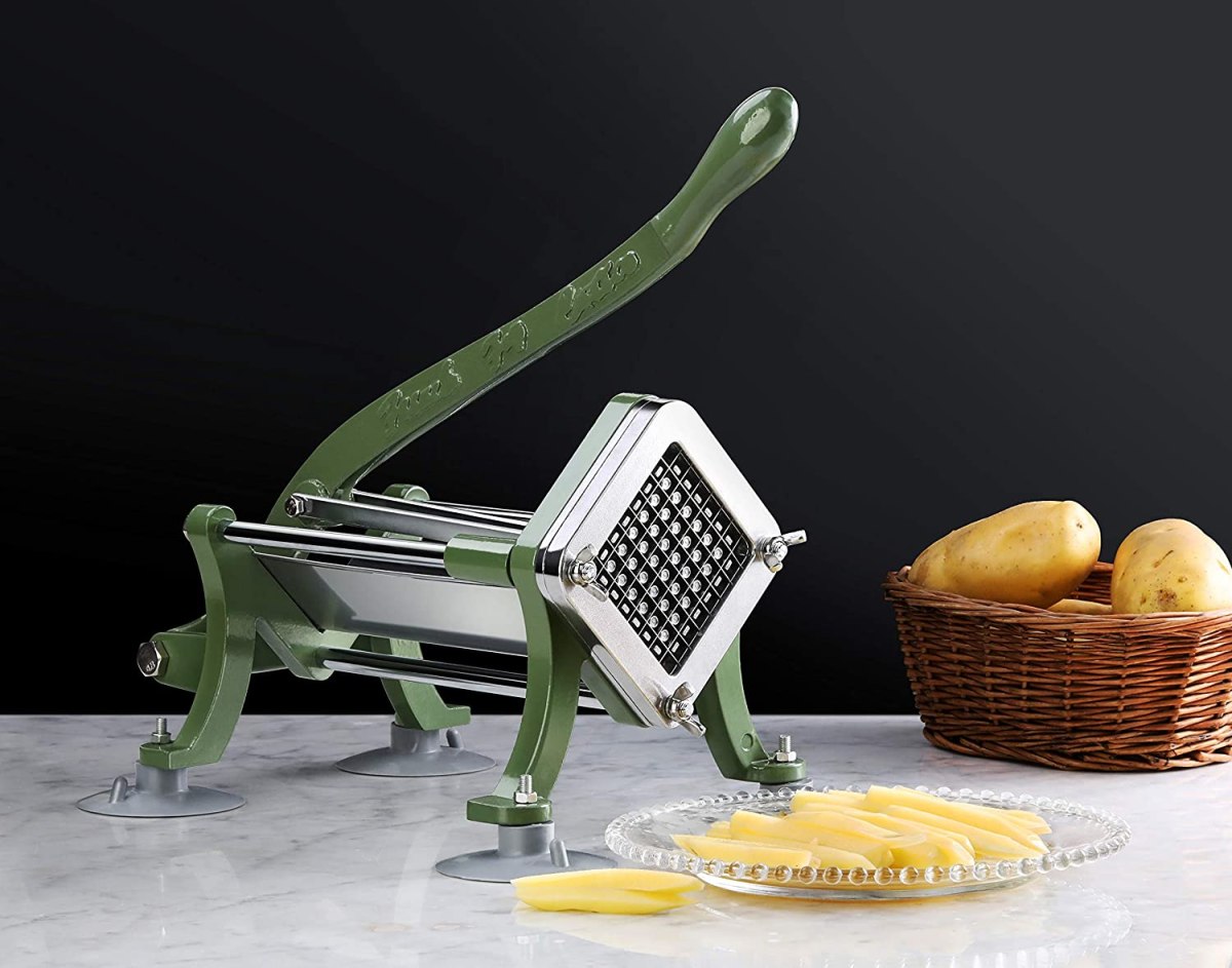 The New Star Foodservice 42306 Commercial Fry Cutter a kitchen counter next to a bowl of whole potatoes and plate of cut potatoes.