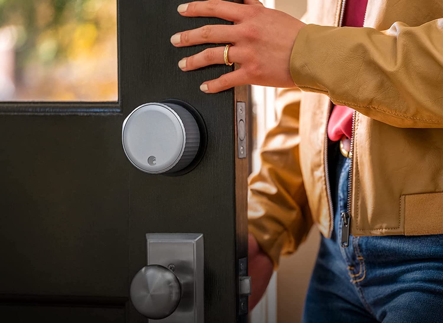 A person opening the door that's equipped with the best keyless door lock option