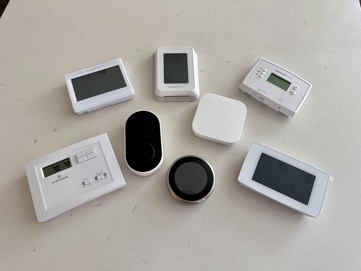 A group of the best home thermostats together on a counter before testing.