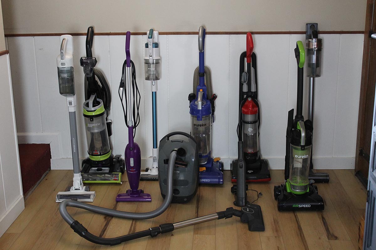 A group of the best lightweight vacuums grouped together against a wall before testing.