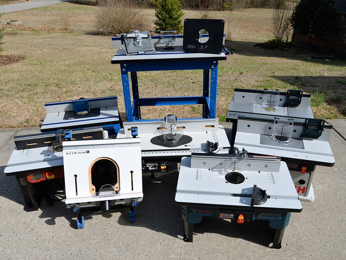 A group of the 10 best router table options together in a cement pad before testing.