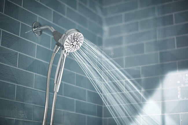 A water saving shower head being used