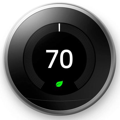 The Google Nest Learning Thermostat on a white background and set to 70 degrees Fahrenheit.