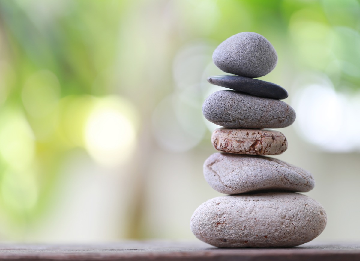balance-stones-stacked-to-pyramid-in-the-soft-green-background-picture-id1041545006