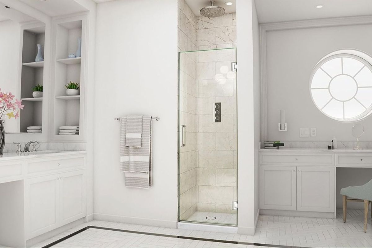 The best shower door option installed in a spacious and bright white bathroom