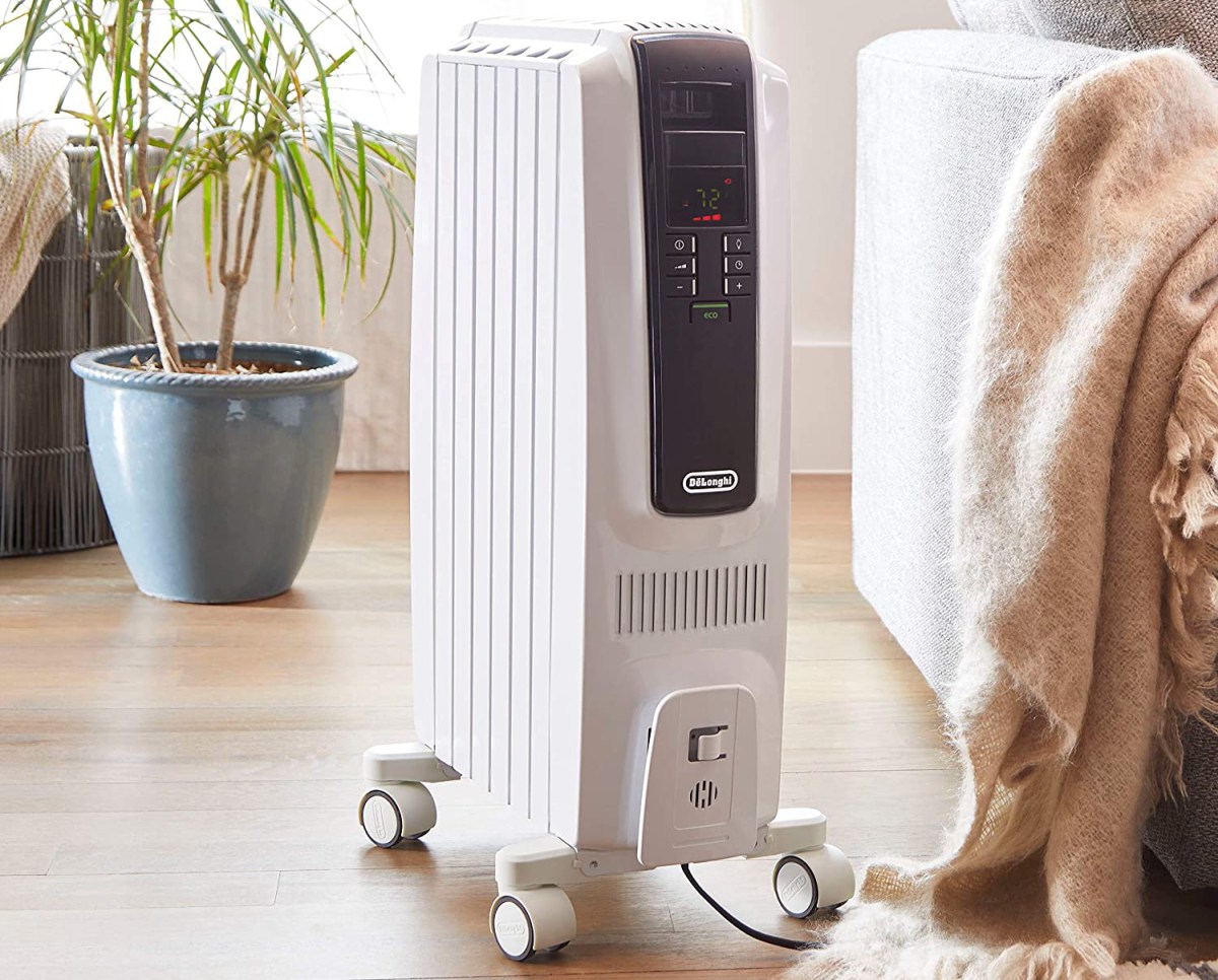 The best space heater for bedrooms option next to a bed