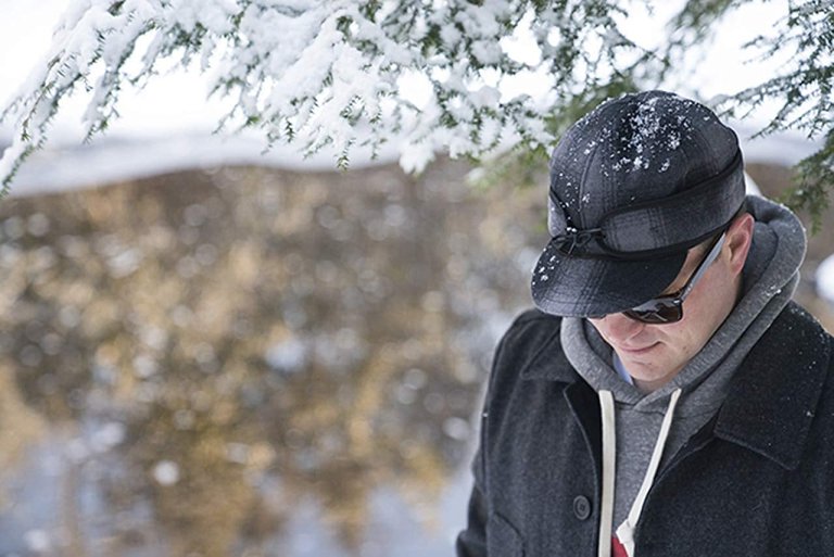 A person wearing one of the best winter hats while outdoors