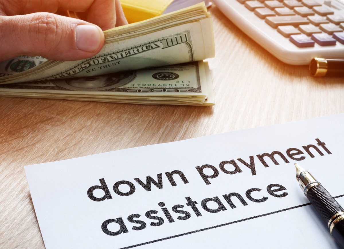 down-payment-assistance-form-and-dollar-banknotes-picture-id961842610