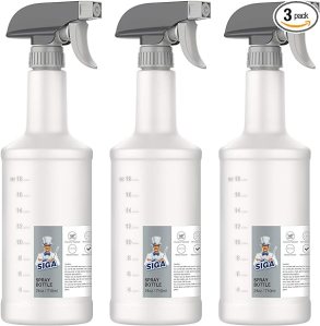 Three empty spray bottles on a white background