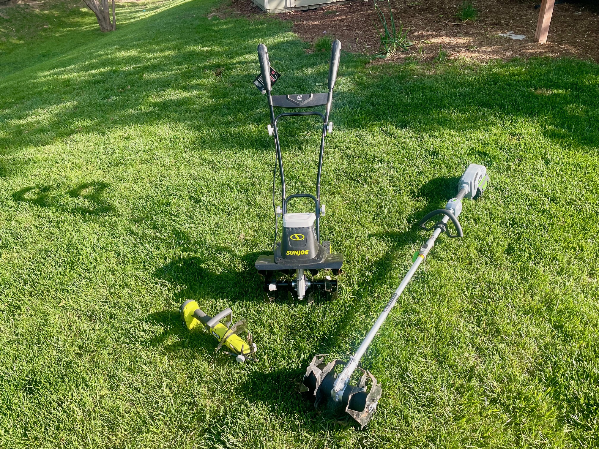 Electric tillers group 2 laid on a grass
