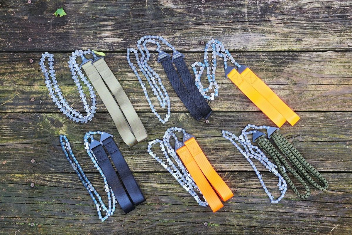 A group of the best pocket chainsaw options together on a picnic table