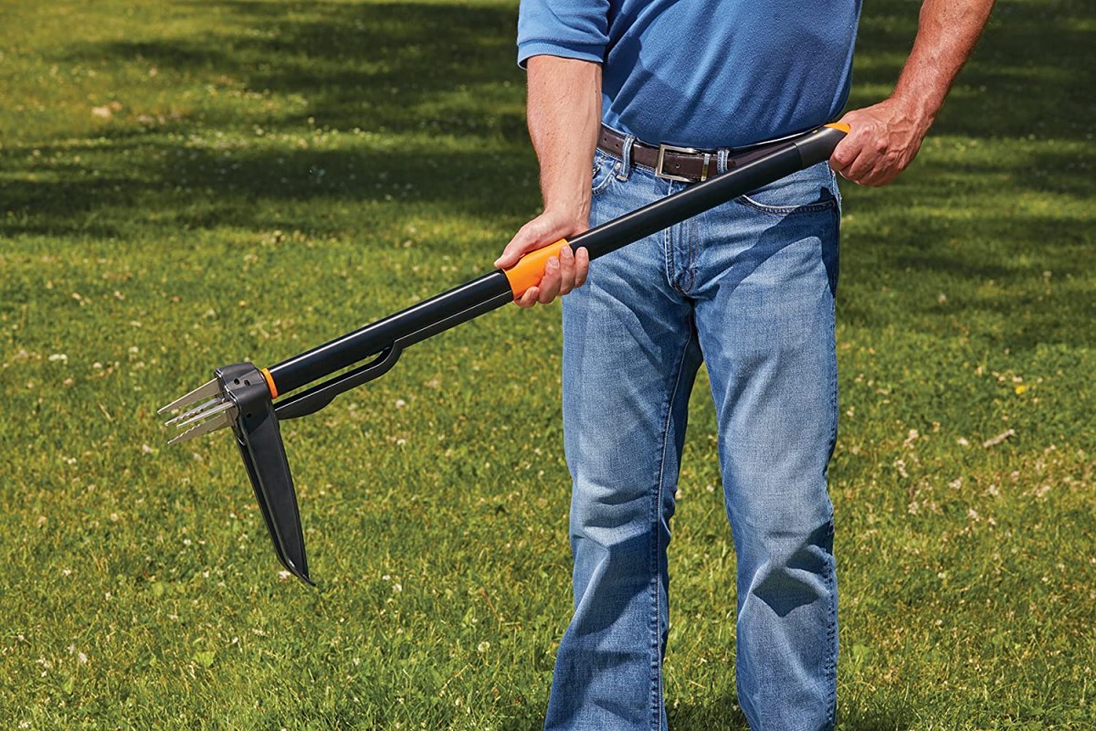 A man holding the best stand-up weeder option