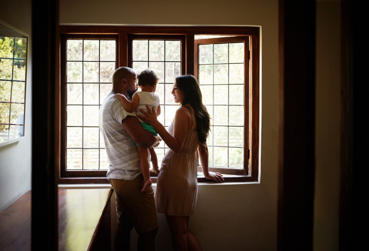 family looking out large thermal window