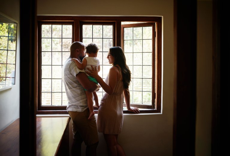 family looking out large thermal window