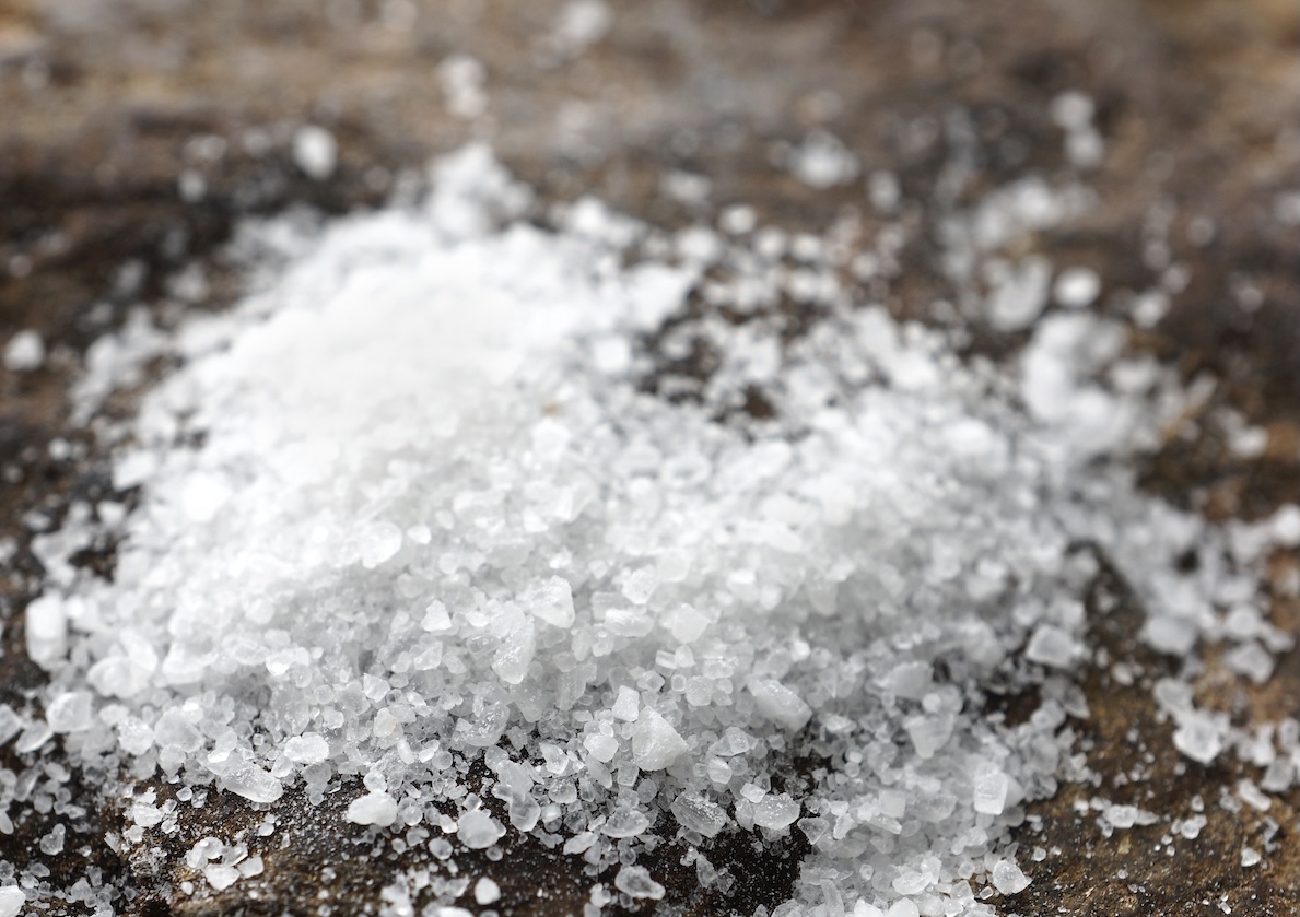 Coarse salt on a wood log
