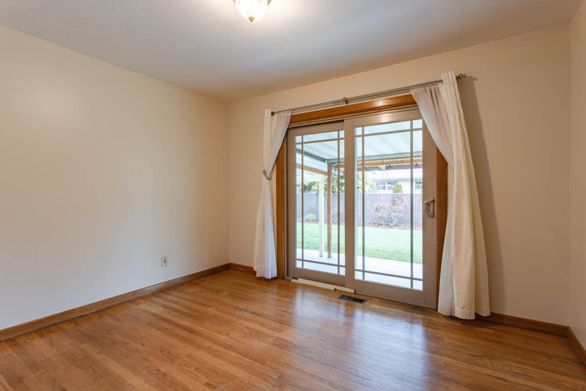 The Best Patio Doors Option in an undecorated room leading to a cement patio