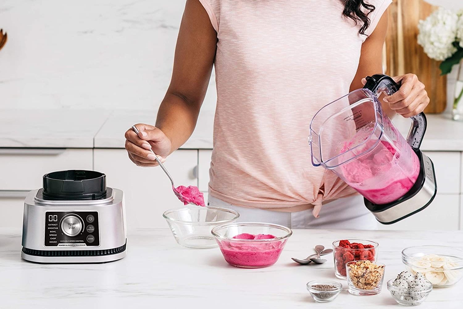 A woman using the best blender food processor combo to make a healthy smoothie