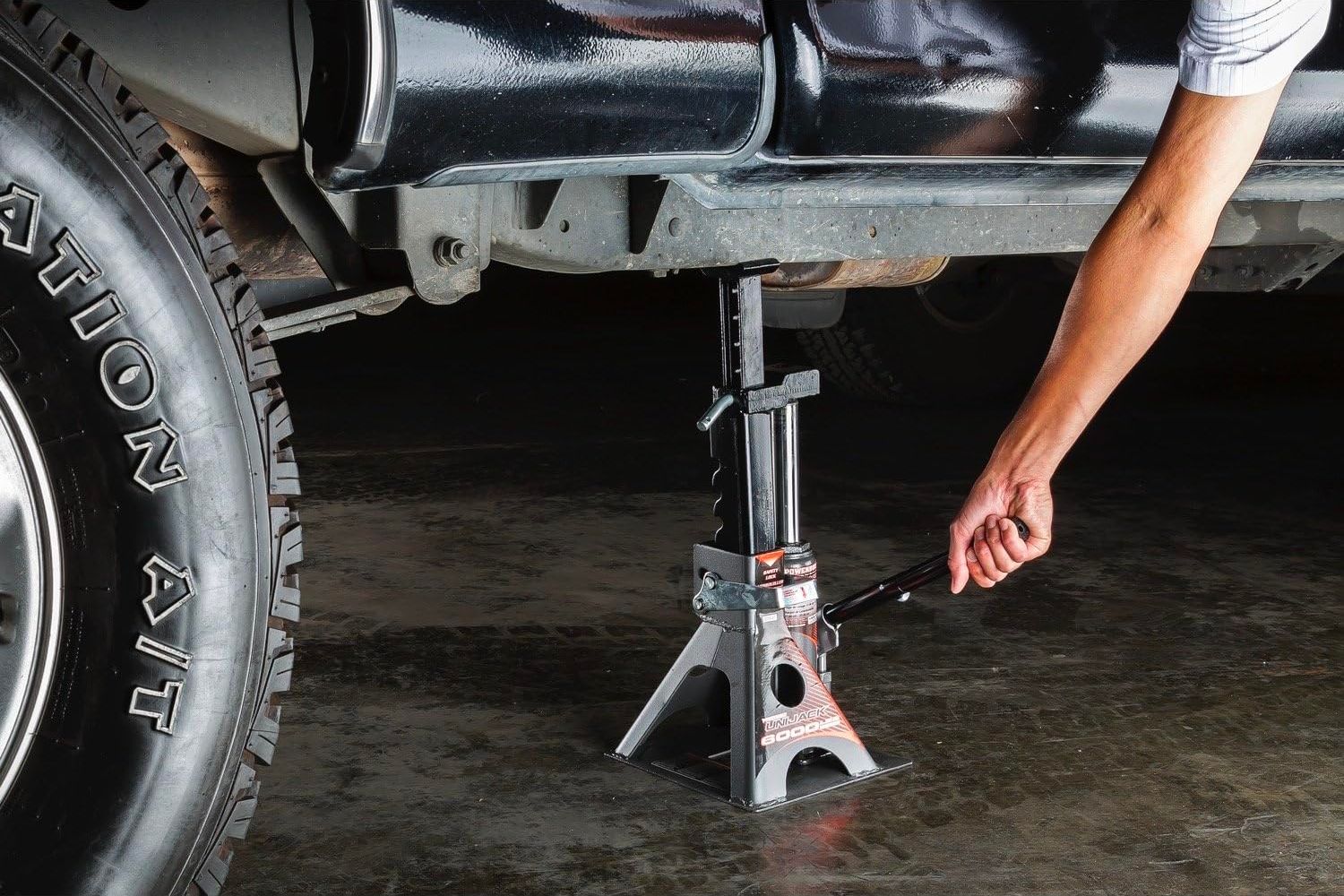 A person using the best floor jack for trucks option