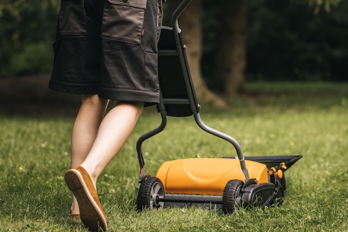 A person using One of the models of the Best Push Mower