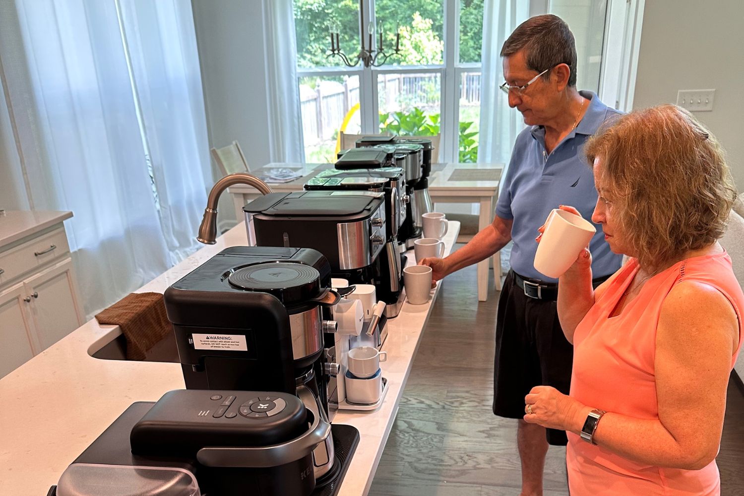A couple taste-testing brewed coffee from a lineup of the best dual coffee makers