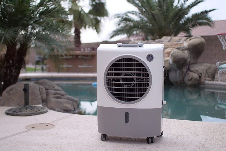 The best evaporative air cooler option on a cement patio next to an outdoor pool