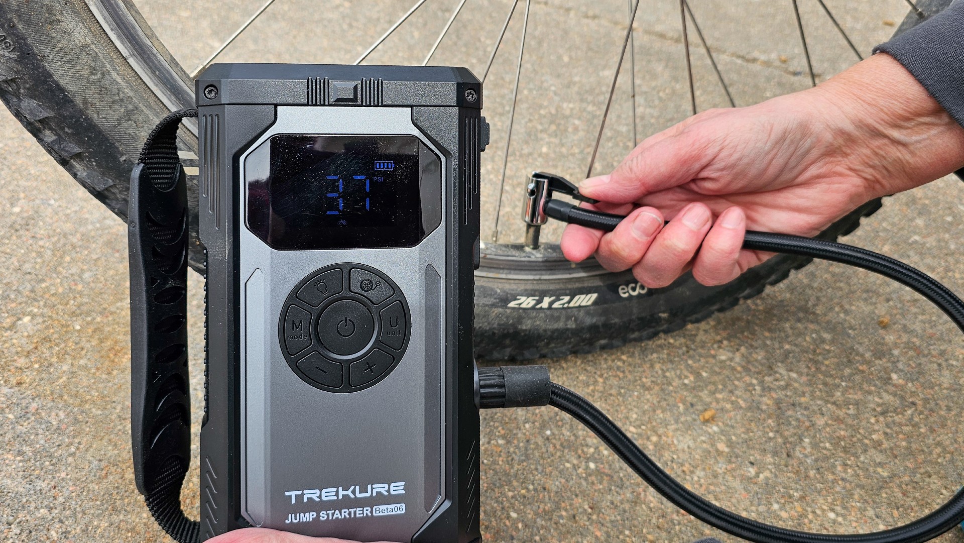 Tekure inflating bike tire.