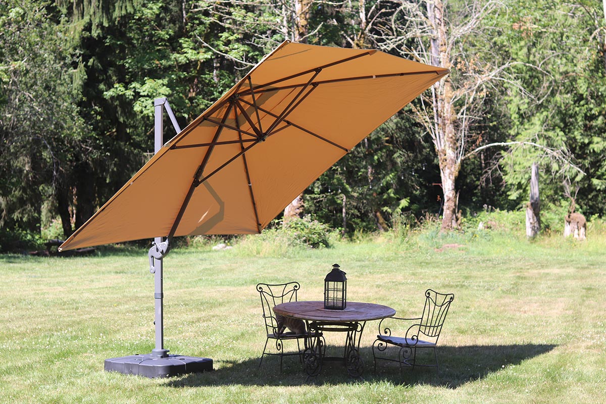 The best cantilever umbrella option set up over a patio table in a sunny backyard