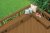 A recently resurfaced deck with surrounding bench shown from above