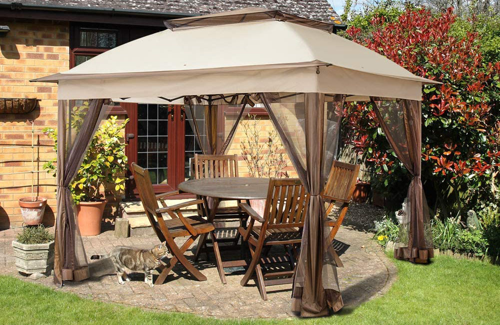 The Best Gazebo Option covering an outdoor table and chairs on a stone patio in a backyard