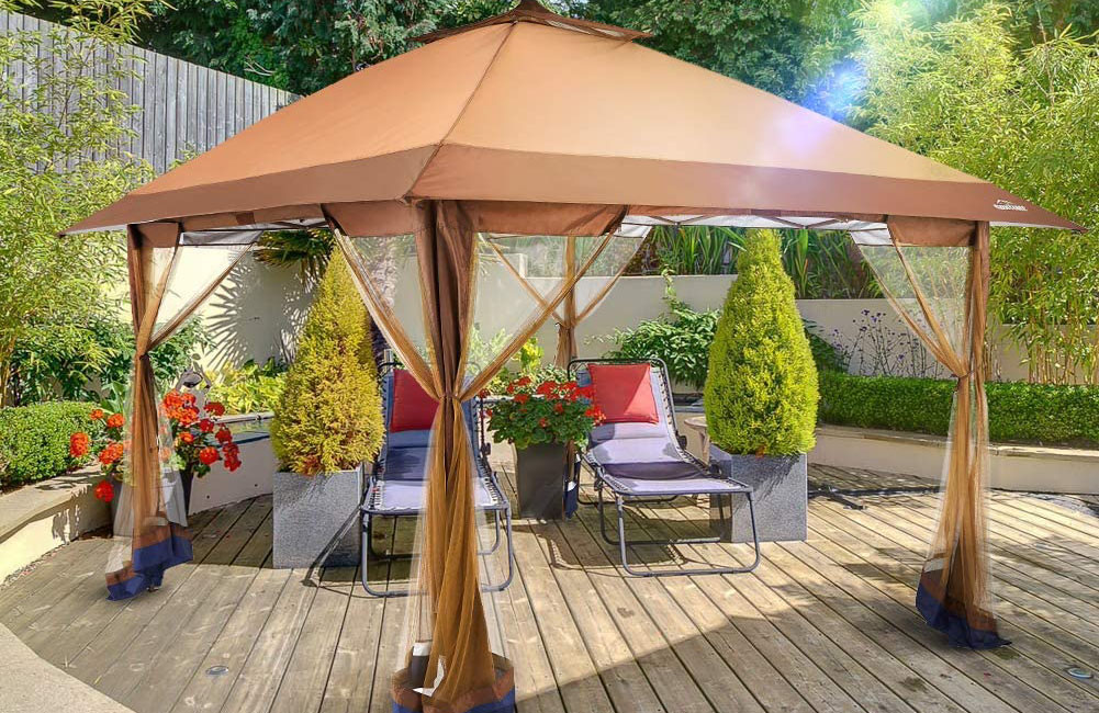 The Best Gazebo Option on a wooden deck in a landscaped yard with two lounge chairs underneath
