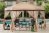 One of the best Gazebos set up over an outdoor dining table next to a pool