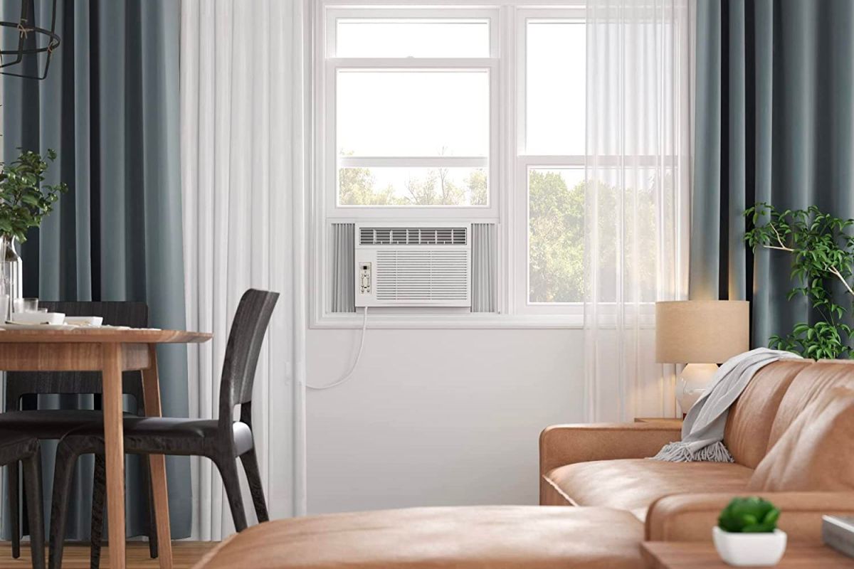 The best 10000 btu window air conditioner placed in a window in a cool and calm room