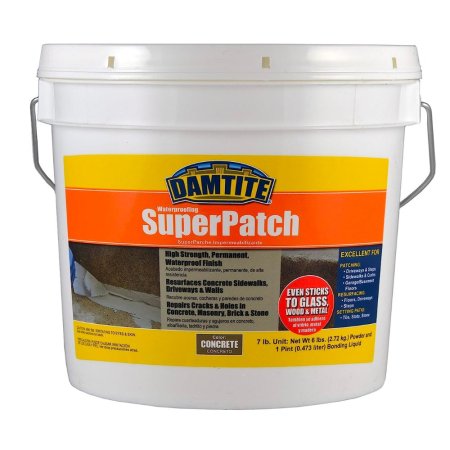  A large white tub of the Damtite Waterproofing SuperPatch crack filler on a white background.