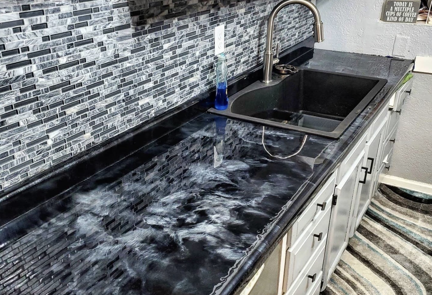A black marble-look kitchen countertop made with epoxy