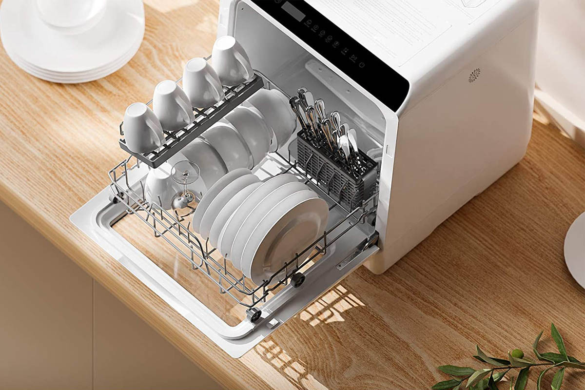 The Best Dishwashers Under $500 Option with its tray open to show a full load of clean dishes