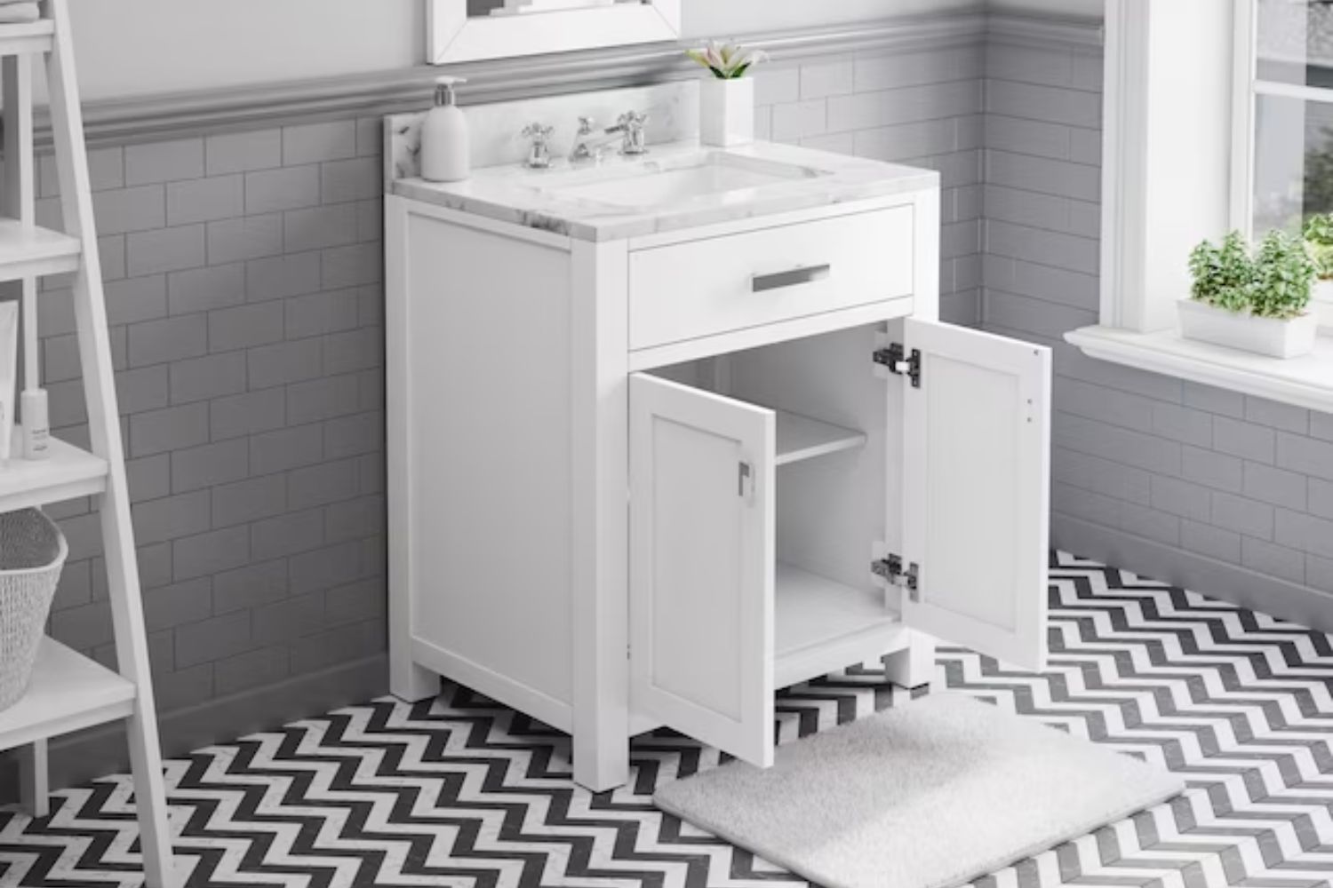 The Andover Mills Rossi 36-Inch Single Bathroom Vanity on a black and white chevron floor with its doors open to show empty shelves inside.