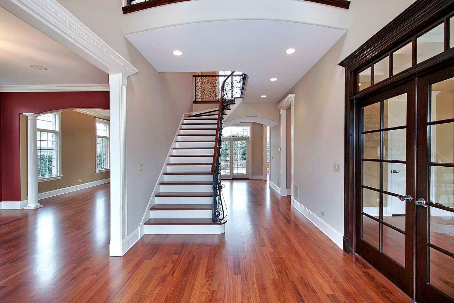A shiny hardwood floor in a large home showing the results of applying the best water-based polyurethane for floors option