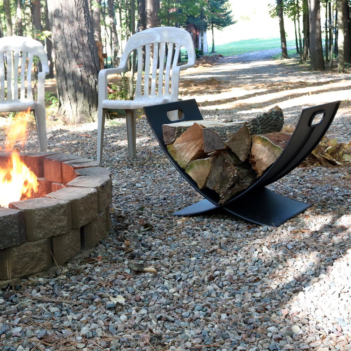 Firewood storage outside near a fire pit.