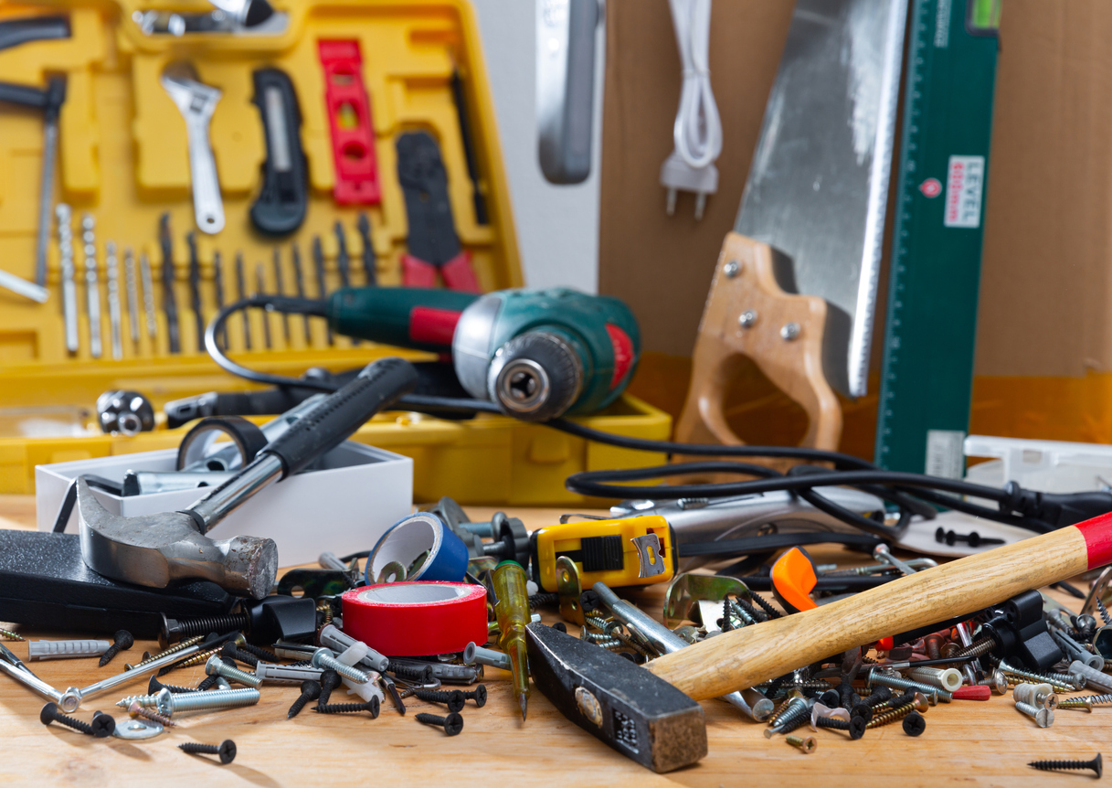 Construction tools and materials on wooden background, repair maintenance concept