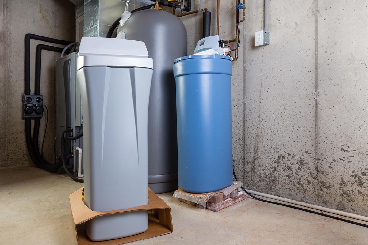 a view of a water softener system in a basement.