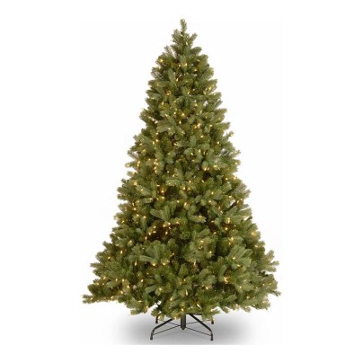 The National Tree Company Full Downswept Christmas Tree in its included stand on a white background.