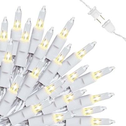 The Lidore 100 Clear Mini Christmas String Lights arranged in a fan shape on a white background.
