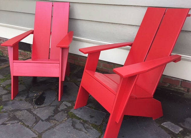 Two Modern Adirondack chairs with square backs painted bright red