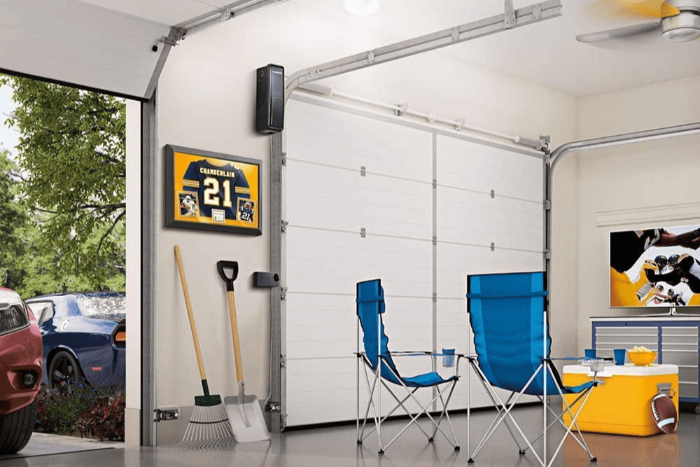 The best garage door openers option installed in a clean garage that's set up for watching sports